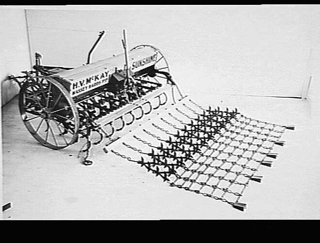 SUNCHAIN HARROW ATTACHED TO 8-ROW SUNTYNE. MAY 1941