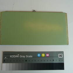 Painted board showing sample of colour green.