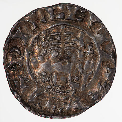 Coin, round, A crowned and diademed bust of the King facing; to right, a sceptre; text around.