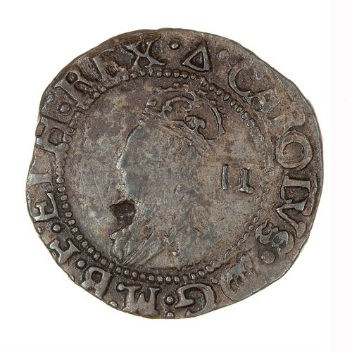 Coin, round, Within an inner circle of beads, the crowned and draped bust of a king facing left; text around.