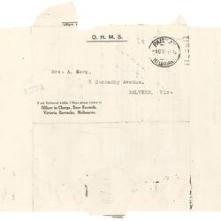 Unfolded letter with black printed text and stamp.