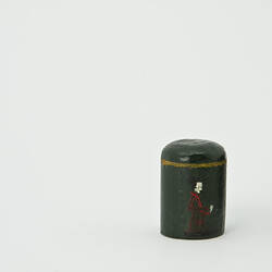 Dark green painted canister with Japanese lady.