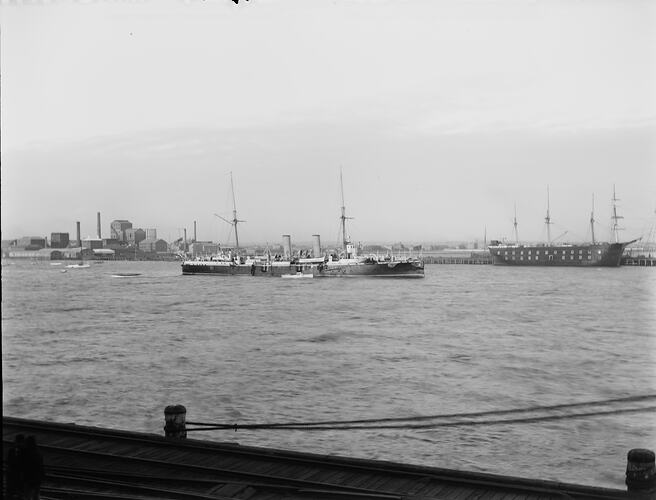View of port with ships and boats in the distance.