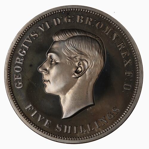 Coin with left facing profile of George VI. Text around.