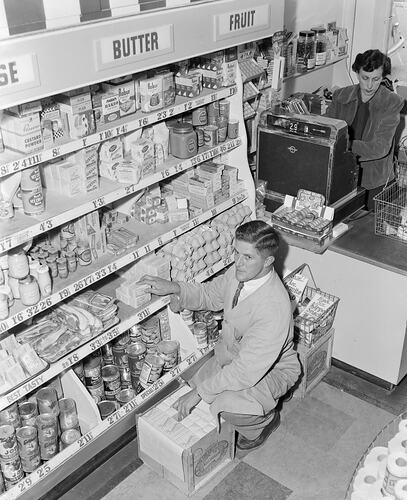 Negative - Man Stocking Shelves in Grocery Store, Victoria, Feb 1954
