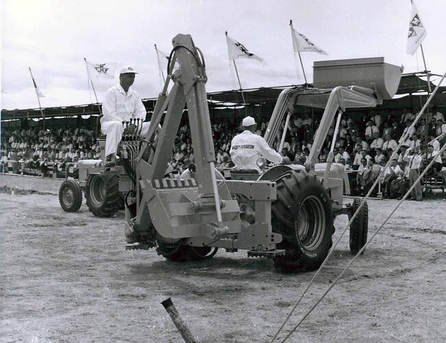 Front-end loader and backhoe on display.