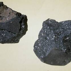 Two meteorite specimens.