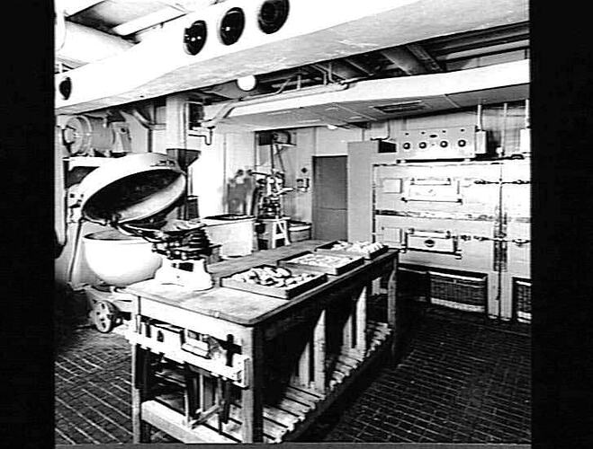 Ship interior. Kitchen with wooden bench and bakery oven.
