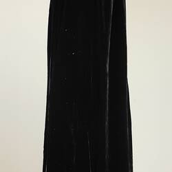 Black ankle length cloak on mannequin, side view.