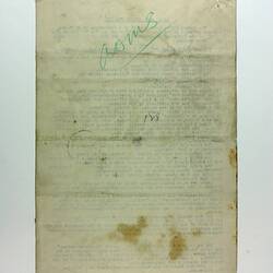 Single blank page on off-white paper with stains and creases, printed text showing through from other side,