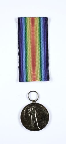 Round medal with angel and rainbow coloured ribbon.