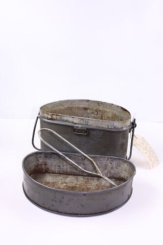 Metal tin with lid.