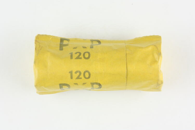 Yellow foil packet with product stamp.