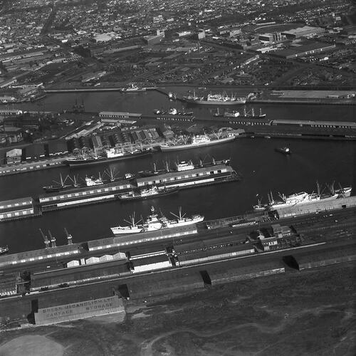 Monochrome aerial image of a shipping dock.