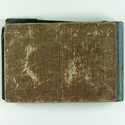 Brown back cover of postcard album.