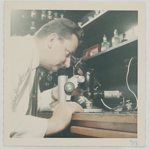 Worker Looking Through Microscope, Kodak Factory, Coburg, circa 1960s