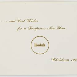 White card with printed gold text.