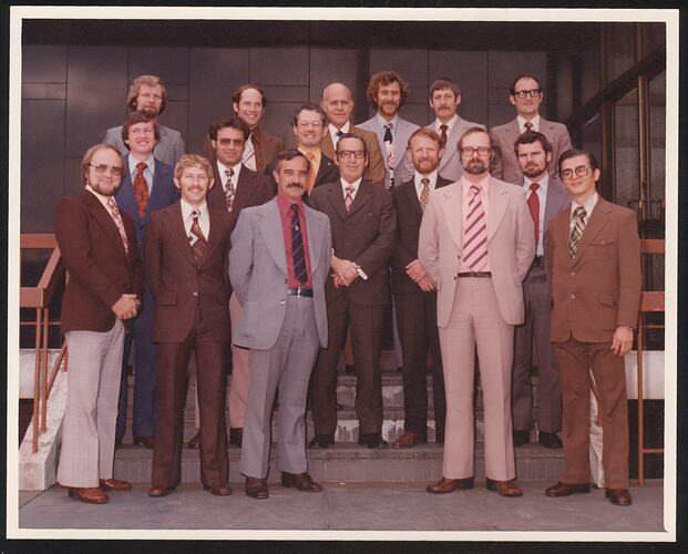 Colour photograph of men in suits.