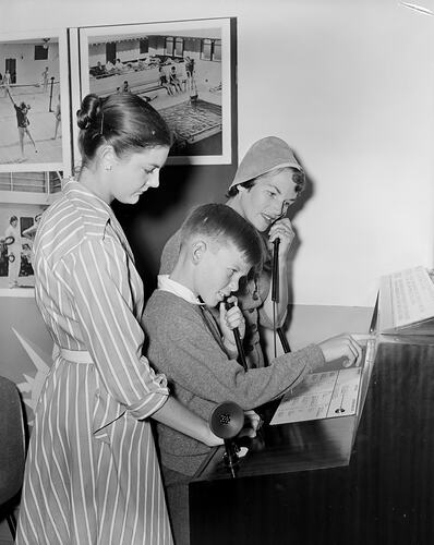 Two Women and a Child at the P&O Exhibition Stand, Exhibition Building, Carlton, Victoria, Mar 1959