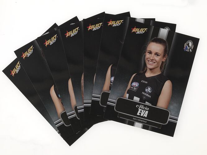 Group of swap cards with portrait photographs of female footballers. Black background.