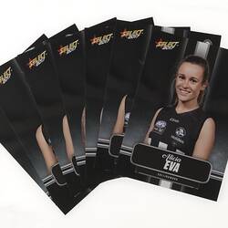 Group of swap cards with portrait photographs of female footballers. Black background.