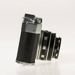 All-metal chrome and black body 35mm camera. Right profile.