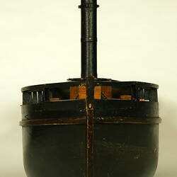 Front view of wooden paddle steamer model.