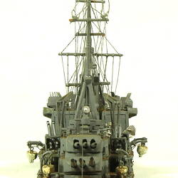 Naval ship with two masts, rear view.