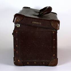 Brown suitcase with lid open, side view.