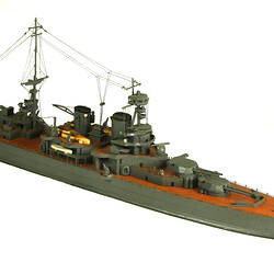 Naval ship with two masts, three quarter view.