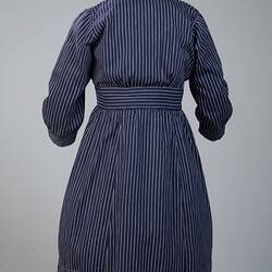 Navy blue cotton dress, with fine white stripes.
