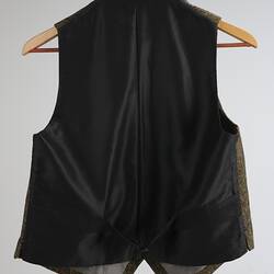 Back of waistcoat, black with adjustment strap.