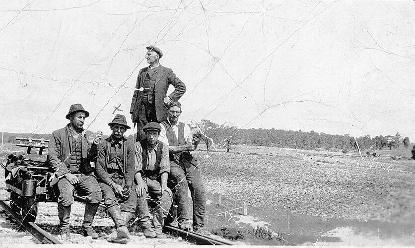 [Railways maintenance staff posed with their trolley, Geelong district, circa 1920.]