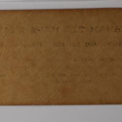 Back of off-white rectangular label.