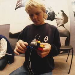 Digital Photograph - Virgil Bulow programming LEGO vehicle using Logo, Sunrise Classroom, Melbourne Museum, Russell Street, 1989