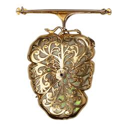 Gold filigree back of white opal, gold and silver brooch in the shape of a flower.