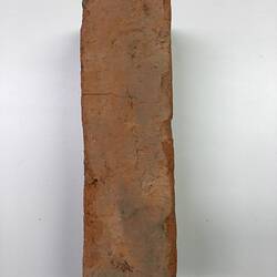 Side edge of red clay brick.