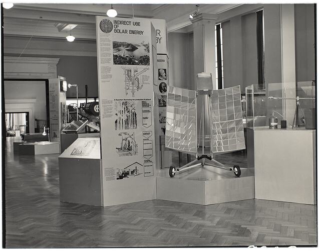 Solar Energy exhibition display. Reflective panels on two wheeled stand.
