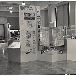 Solar Energy exhibition display. Reflective panels on two wheeled stand.