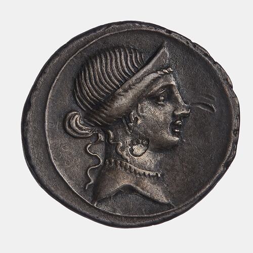 Round coin with female bust wearing a stephane and necklace facing right.