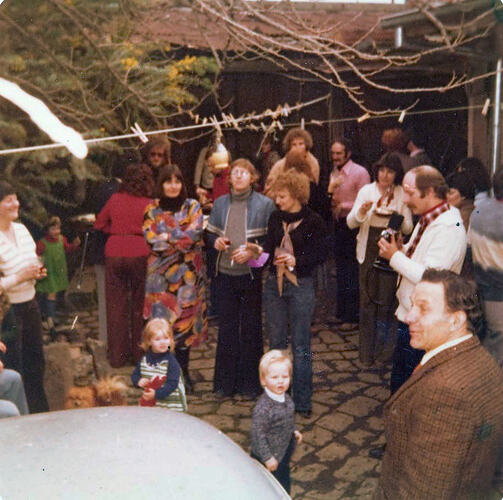 Digital Photograph - Family & Friends Celebrating Girl's First Birthday in Courtyard, Fitzroy, 1978