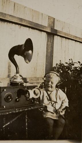 Digital Photograph - Boy Listening to Crystal Set Radio, Backyard, Yarraville, circa 1925