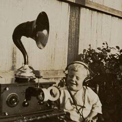 Digital Photograph - Boy Listening to Crystal Set Radio, Backyard, Yarraville, circa 1925