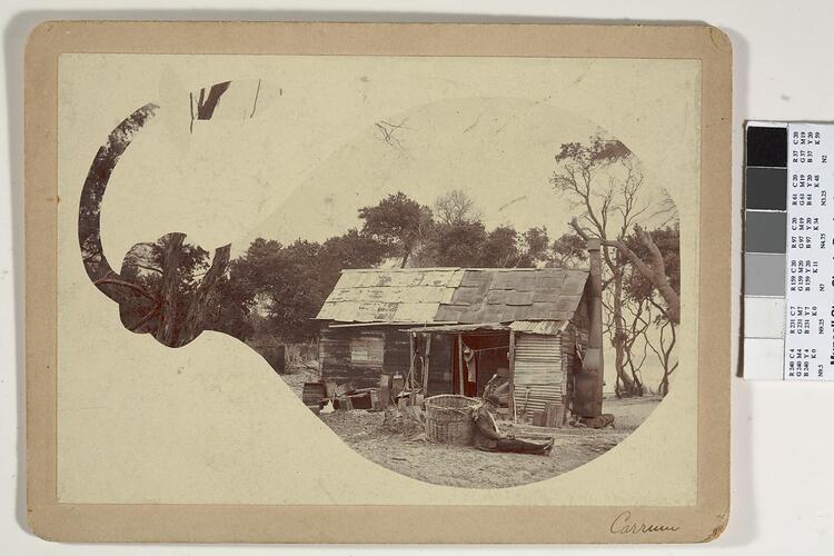 Digital Photograph - Man Sitting Against Basket, in front of Wooden Cottage with Shingle Roof, Carrum, 1890-1900