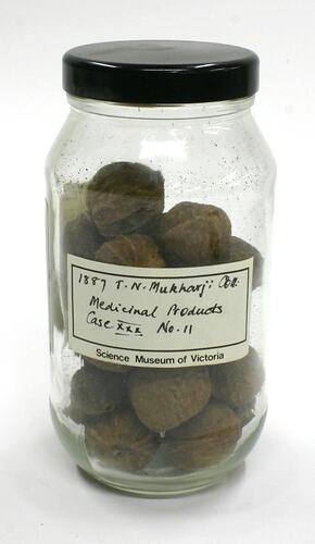 Jar of dried fruit with black lid.