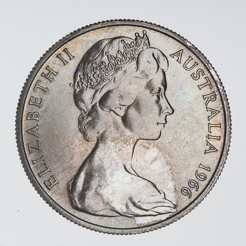 Round silver coin with profile bust of Queen Elizabeth II facing right.