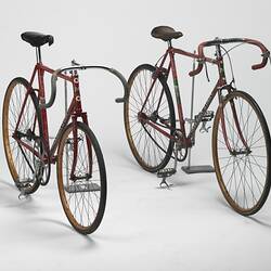 Two red Malvern Star road bicycles.