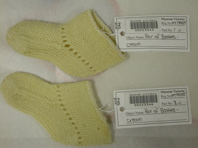 Pair of cream knitted booties.