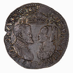 Coin, round, Busts of Philip and Mary face to face below a crown that divides the date 1554; text around.