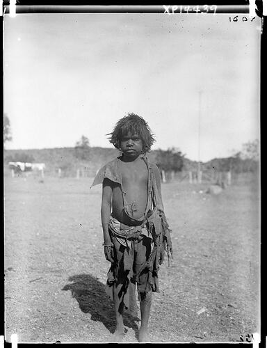 Arrernte boy wearing cast-off clothing at Alice Springs Telegraph Station, Alice Springs, Central Australia, 1901